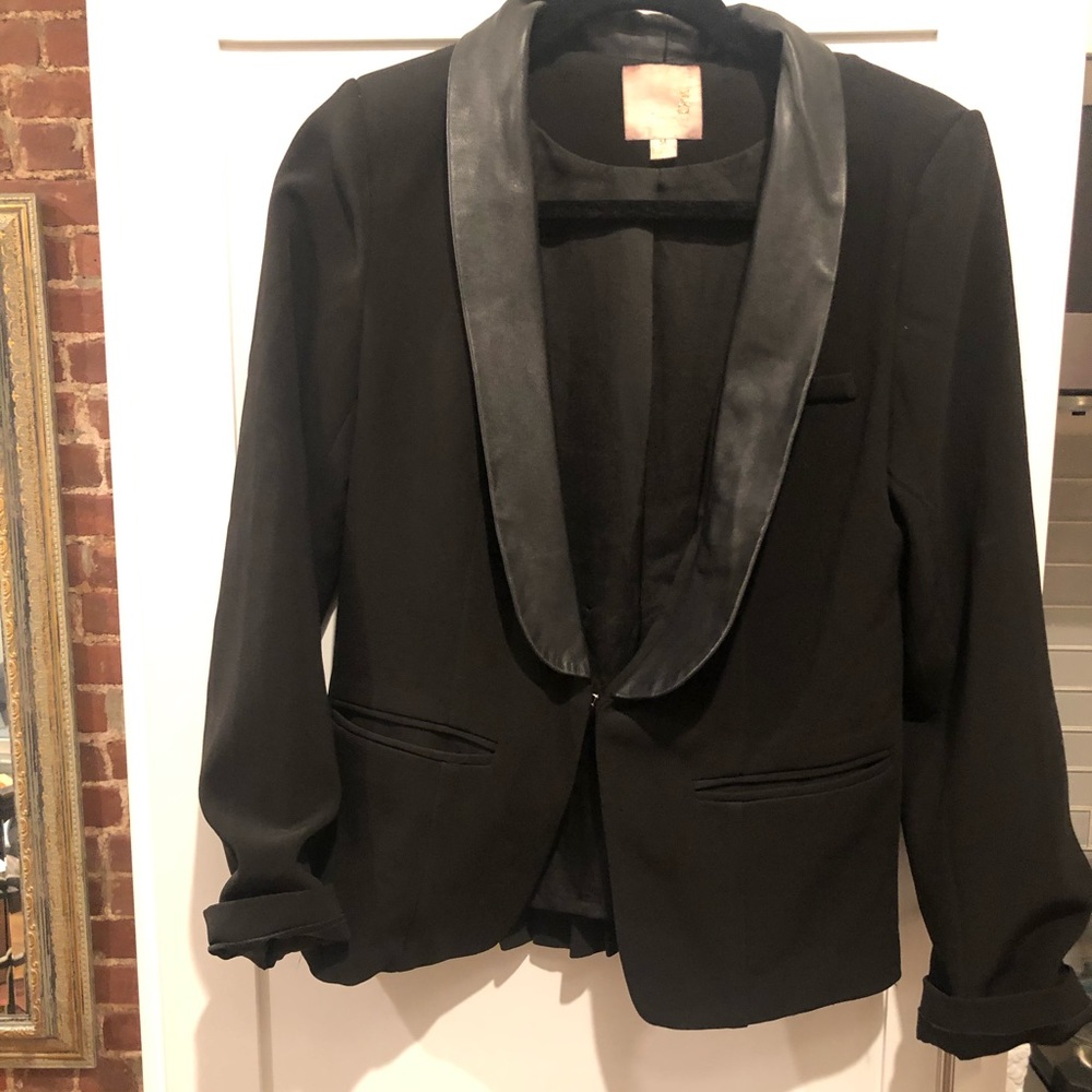 Black blazer with leather collar.